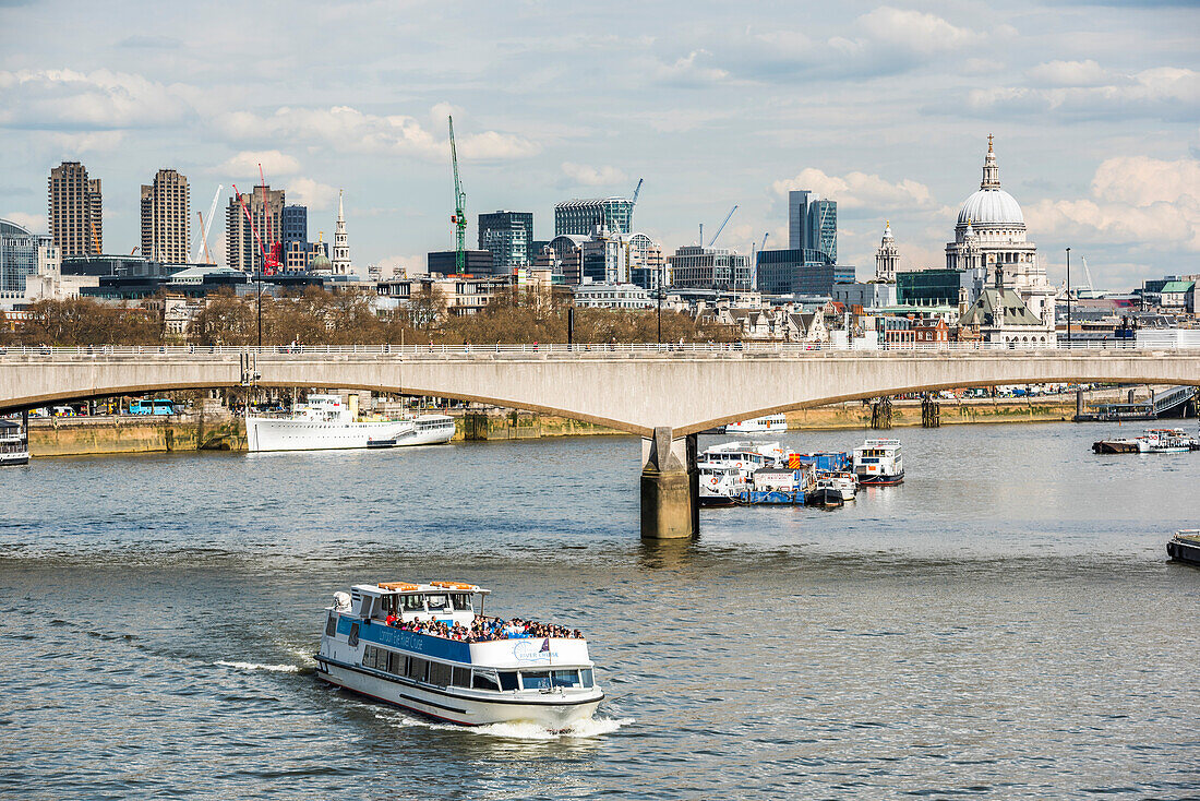 River Thames cruise with St Pauls Cathedral and Waterloo Bridge behind, London, England, United Kingdom