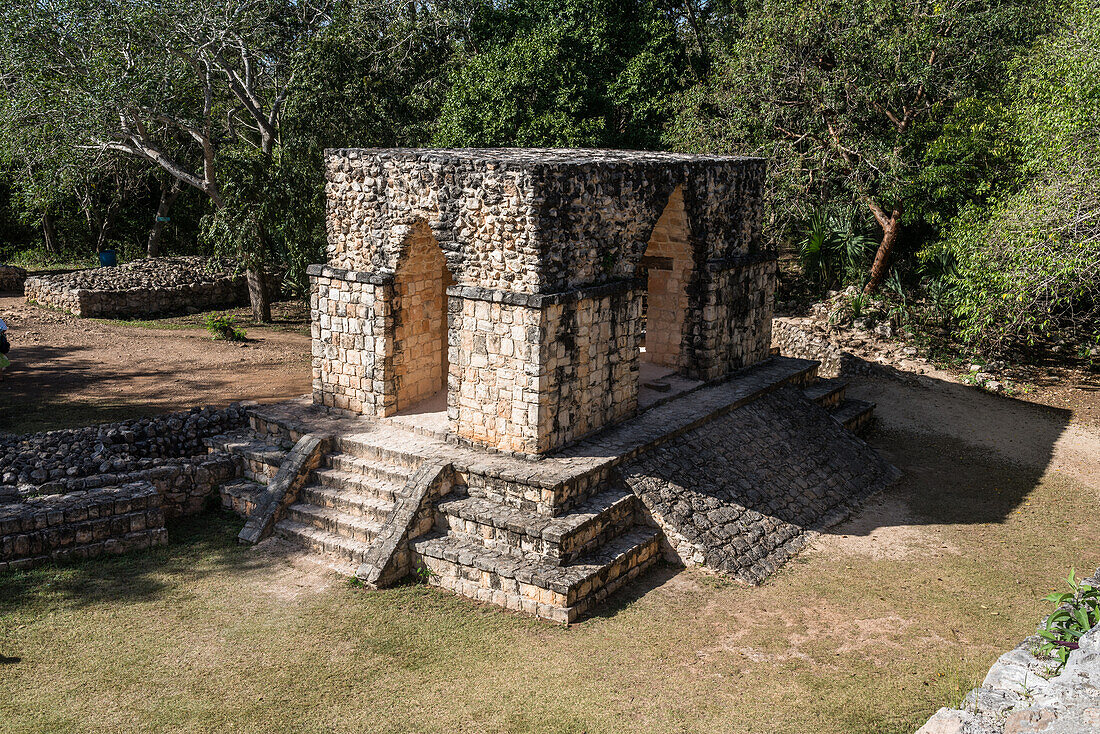 The Entrance Arch in the ruins of the pre-Hispanic Mayan city of Ek Balam in Yucatan, Mexico. It has stairs or a ramp and an arch on all four sides.