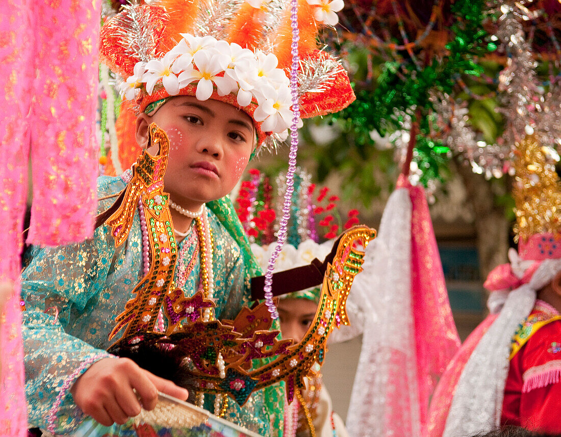 Procession and ceremony for young boys about to become novice monks by the Shan people of Burma at Wat Khun Thwong Buddhist temple in Chiang Mai, Thailand.