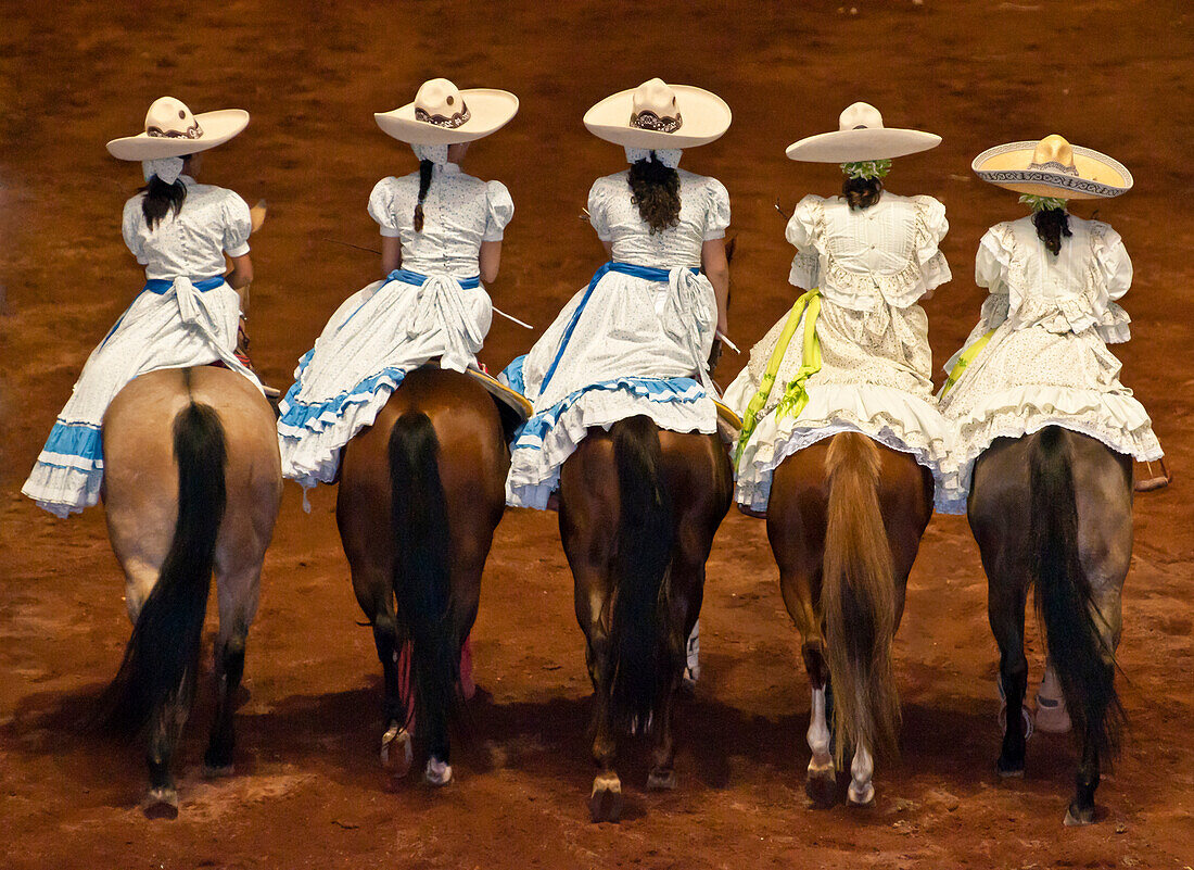 Women horse riders at Lienzo Charro charreada show, Guadalajara, Mexico.