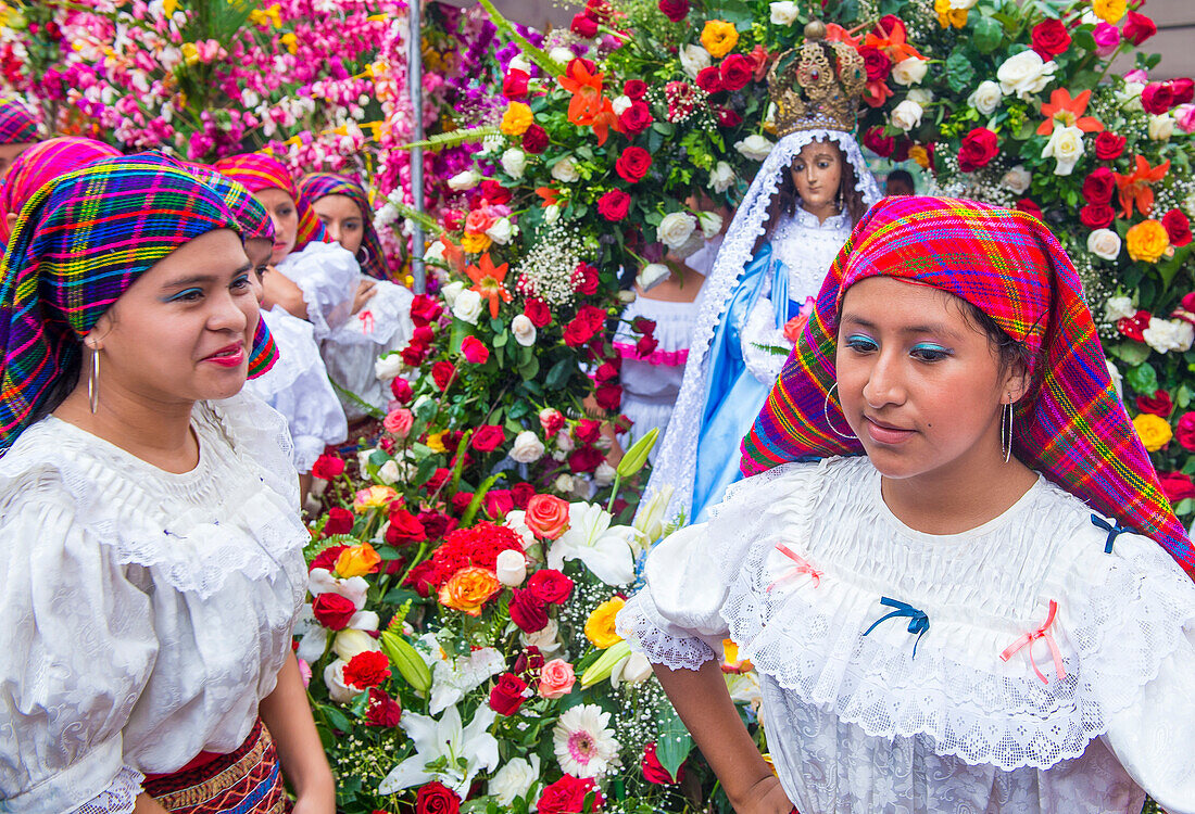 Salvadorian people participate in the procession of the Flower & Palm Festival in Panchimalco, El Salvador