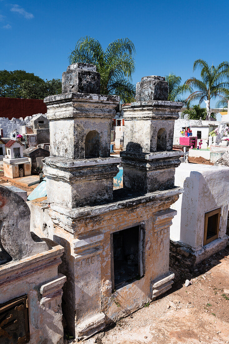 Colorful gravestones in a cemetery at Cacalchen, Yucatan, Mexico.