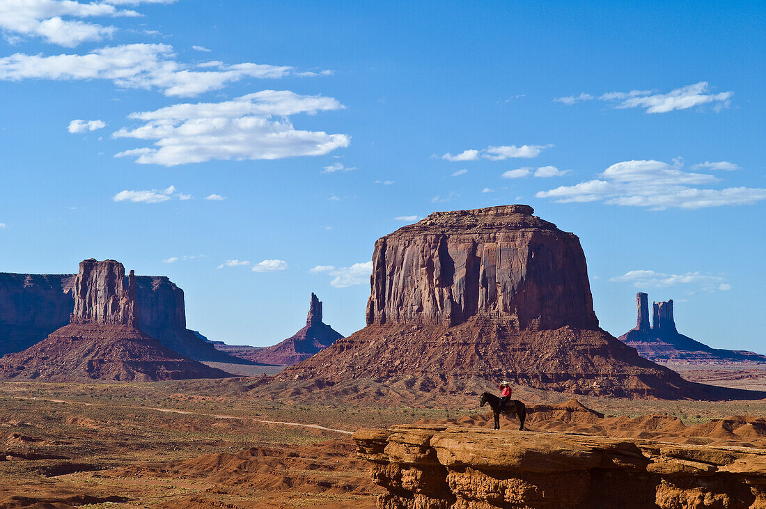 Monument Valley with Navajo man posing on horseback at John Ford?s Point; Monument Valley Navajo Tribal Park on the Utah-Arizona border.
