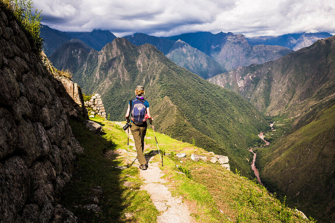 Hiking into Winaywayna Inca Ruins on Inca Trail Trek day 3, Cusco Region, Peru
