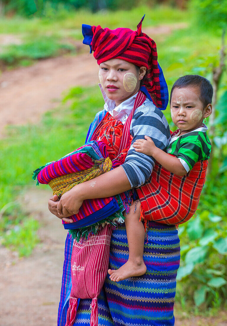 Intha tribe woman with her child in Inle lake Myanmar