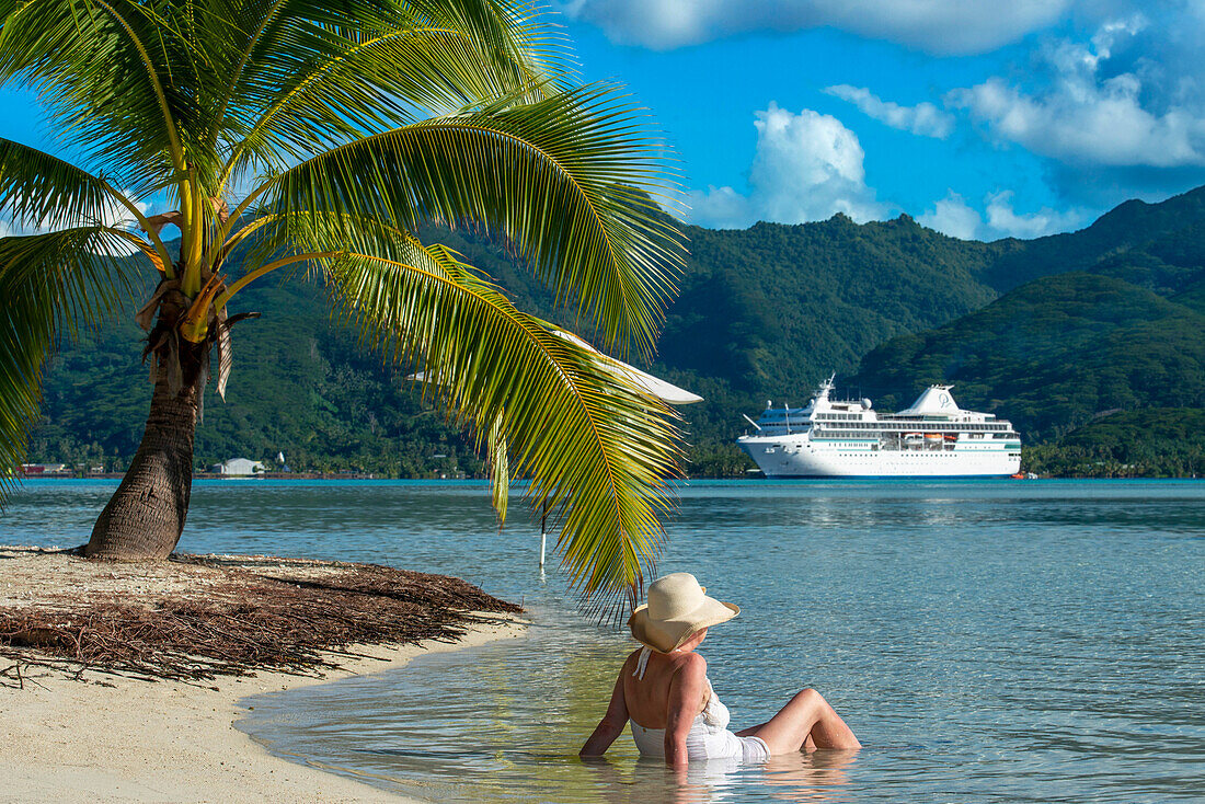 Paul Gauguin docked in the Island of Taha'a, French Polynesia. Motu Mahana palm trees at the beach, Taha'a, Society Islands, French Polynesia, South Pacific.