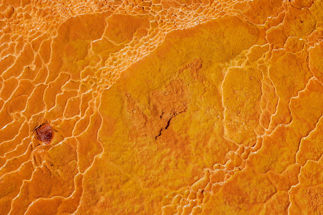 Colorful travertine deposits around the Crystal Geyser, a cold-water geyser near Green River, Utah.