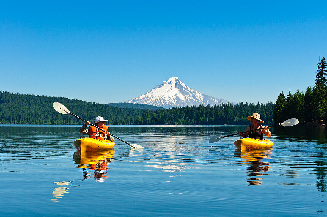Woman and son kayaking at Timothy Lake, Mount Hood National Forest, Oregon.