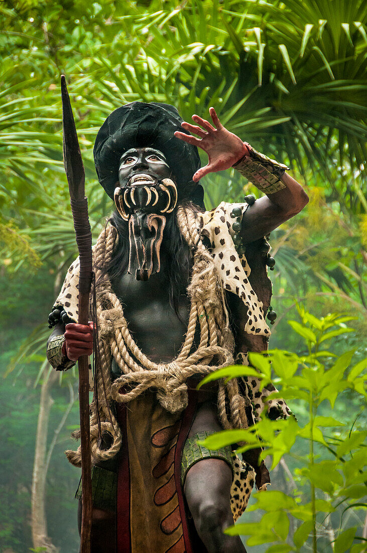 Performer portraying the Maya god "Ek chuah" or God of Cacao (chocolate) during the show "Los Rostros de Ek chuah" at Xcaret eco-archeological park, Riviera Maya, Mexico.