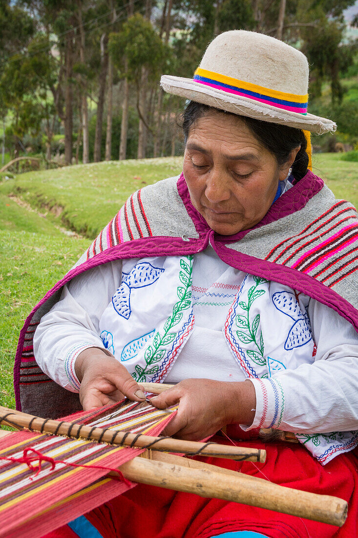 Quechua woman weaving cloth in Misminay Village, Sacred Valley, Peru.