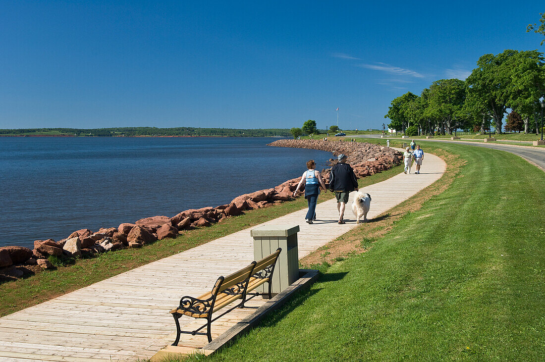People walking on waterfront pathway in Victoria Park, Charlottetown; Prince Edward Island, Canada.