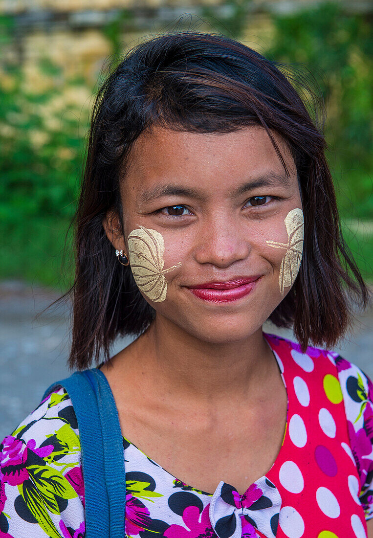 Portrait of Burmese girl with thanaka on face on Mandalay Myanmar