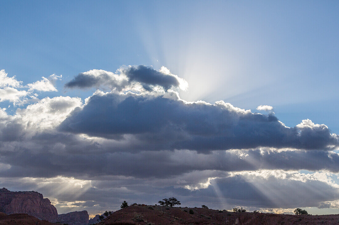 Sun rays through the clouds over Capitol Reef National Park in Utah.
