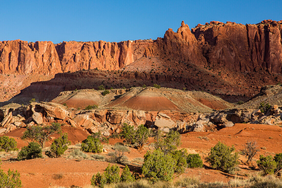 Eroded sandstone formations and cliffs in Capitol Reef National Park in Utah.