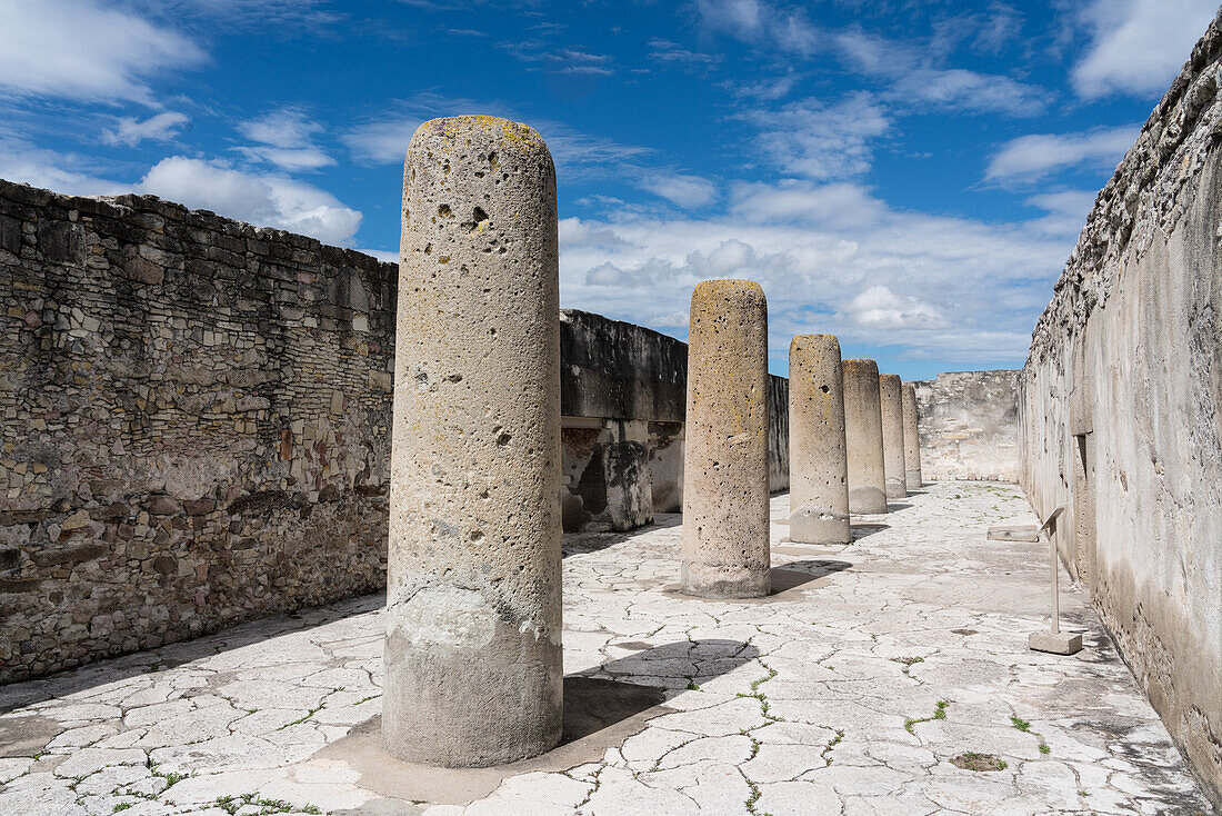 Stone pillars in the Hall of the Columns in the Palace, Building 7, in the ruins of the Zapotec city of Mitla in Oaxaca, Mexico. A UNESCO World Heritage Site.