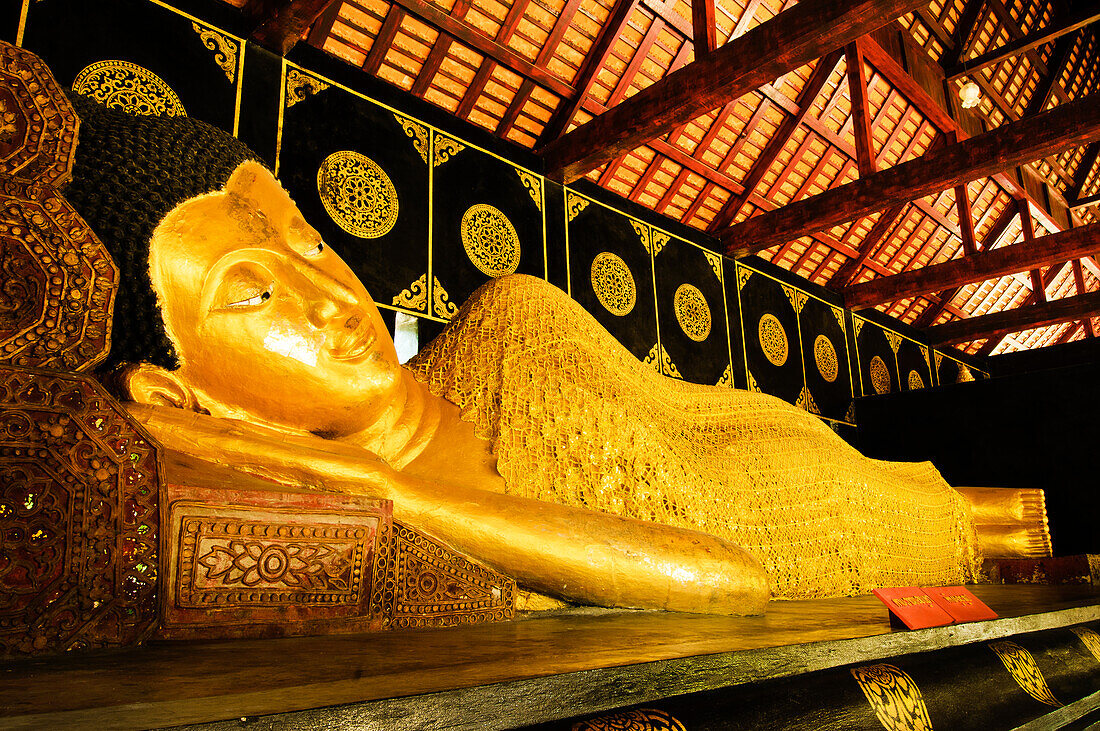 Reclining Buddha at Wat Chedi Luang Wora Wihan Buddhist temple in Chiang Mai, Thailand.