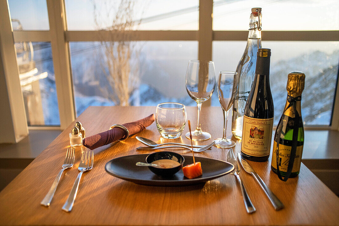 Traditional dinner on the sunset in The Observatory Of Pic Du Midi De Bigorre, Hautes Pyrenees, Midi Pyrenees, France