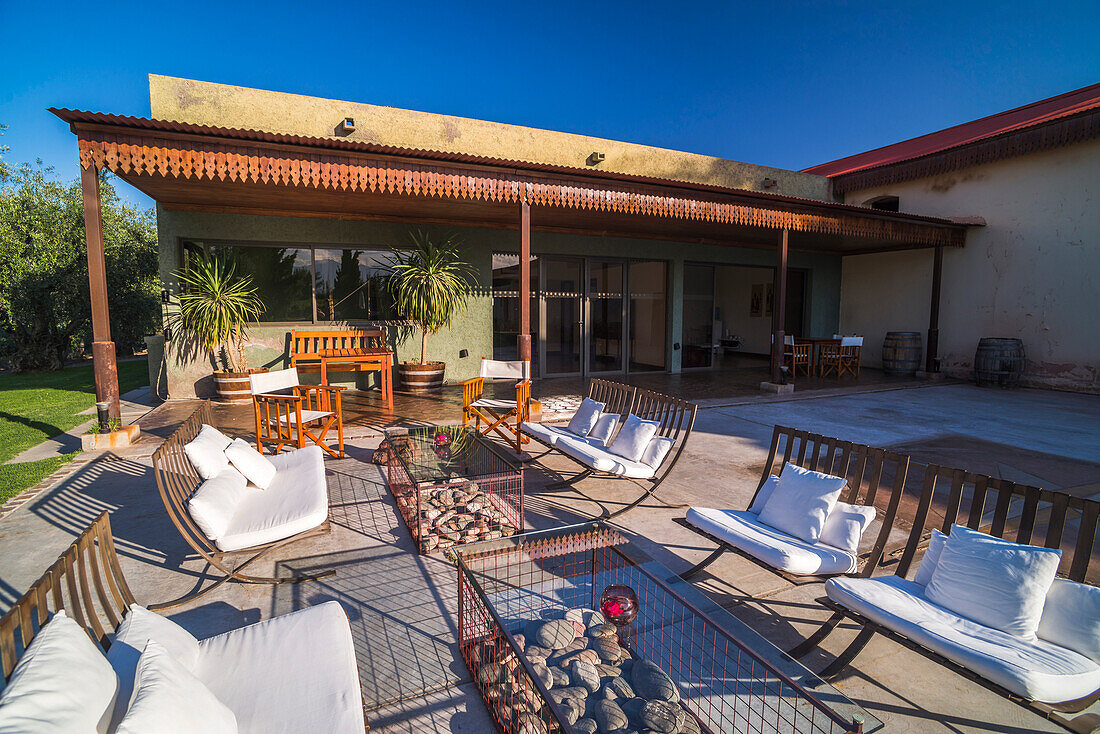 Outdoor seating area at Resort Club Tapiz Boutique Hotel, a Bodega (winery) and accommodation in the Maipu area of Mendoza, Mendoza Province, Argentina