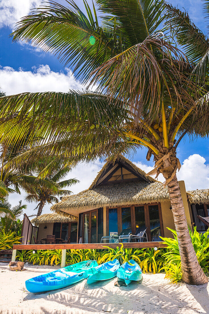 Sea view Luxury Villas on the beach front with tropical palm trees and a sandy beach, Muri, Rarotonga, Cook Islands