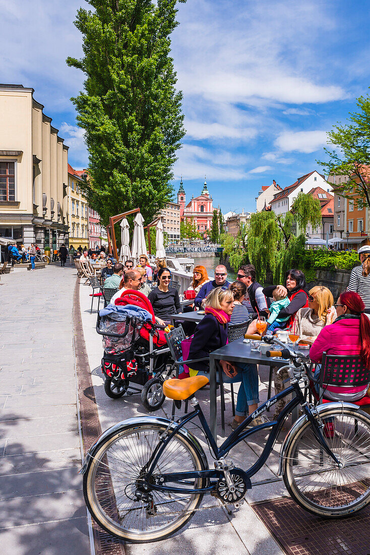 Cafe culture in Ljubljana, on the Ljubljanica River front, Slovenia, Europe