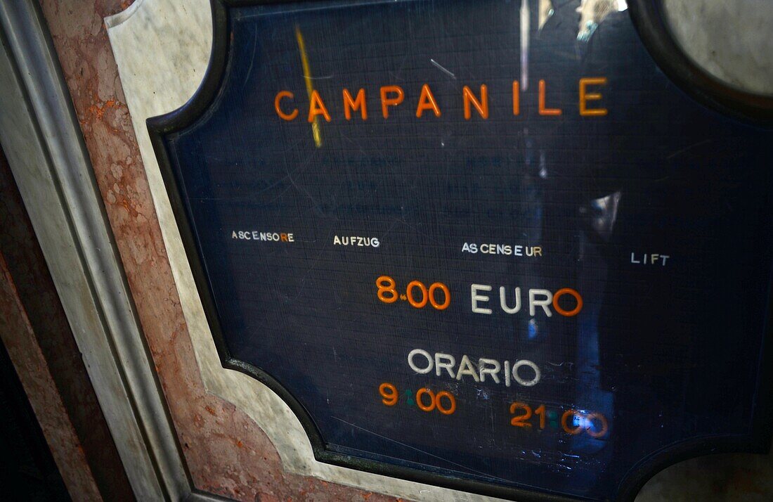 Price and schedule sign at the Campanile di San Marco (St. Mark's bell tower) in Piazza San Marco, Venice, Italy