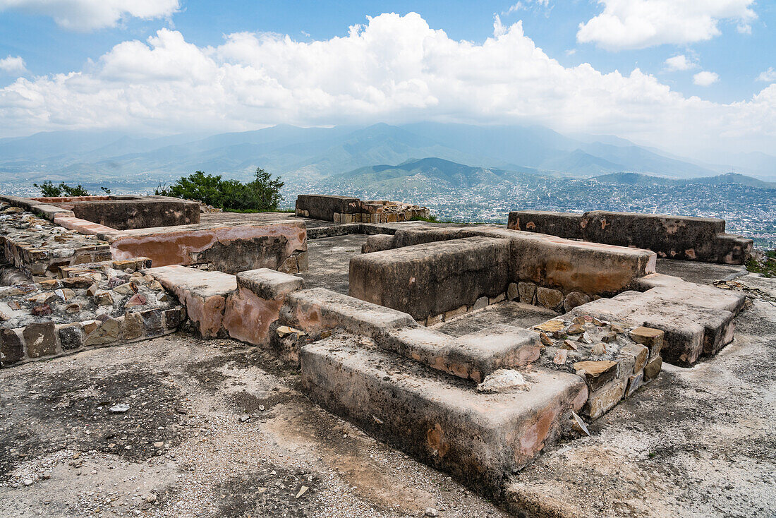 Service housing for the House of the Altars or Casa de los Altares in the ruins of the Zapotec city of Atzompa, near Oaxaca, Mexico. In the background is the Central Valley and city of Oaxaca.