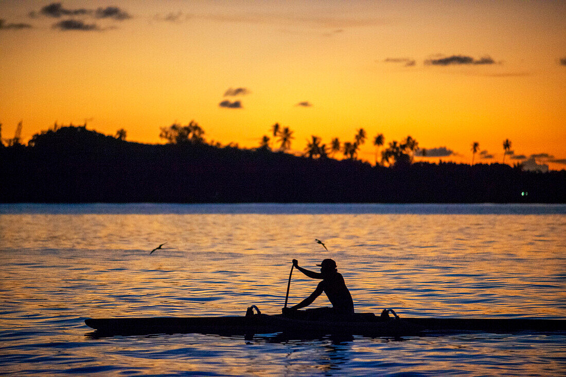 Rowing at sunset in Tahiti, French Polynesia, Tahiti Nui, Society Islands, French Polynesia, South Pacific.