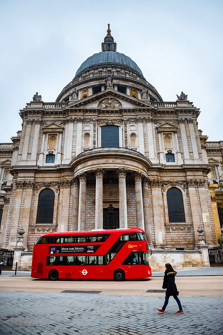 Red London Bus in front of St Pauls Cathedral, City of London, London, England