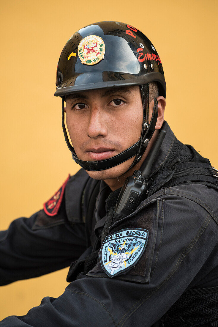 Policeman with national police force in Lima, Peru.