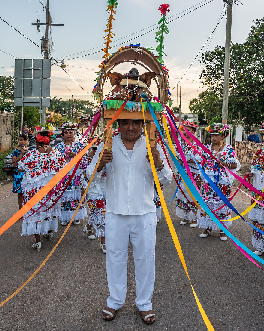 A man carrying the pig's head prepares for the Dance of the Pig's Head and of the Turkey, or Baile de la cabeza del cochino y del pavo in Santa Eleana, Yucatan, Mexico. This Mayan festival dance is performed only once each year.