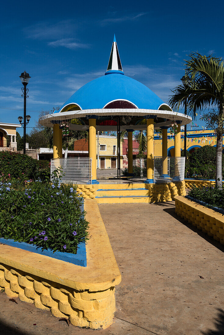 The colorfully painted gazebo in the main plaza in Chapab de las Flores in Yucatan, Mexico.