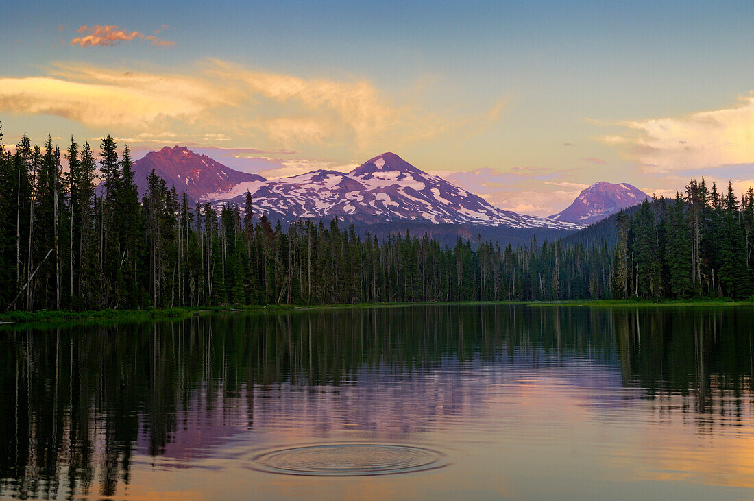 Scott Lake and the Three Sisters (volcanic moutain peaks) at sunset; Cascade Mountains, Oregon.