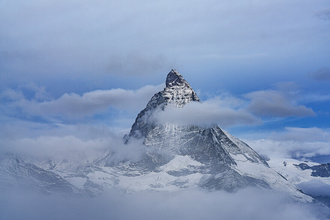 Majestic Matterhorn in autumn mist during the blue hour, Gornergrat, Zermatt, canton of Valais, Switzerland, Europe