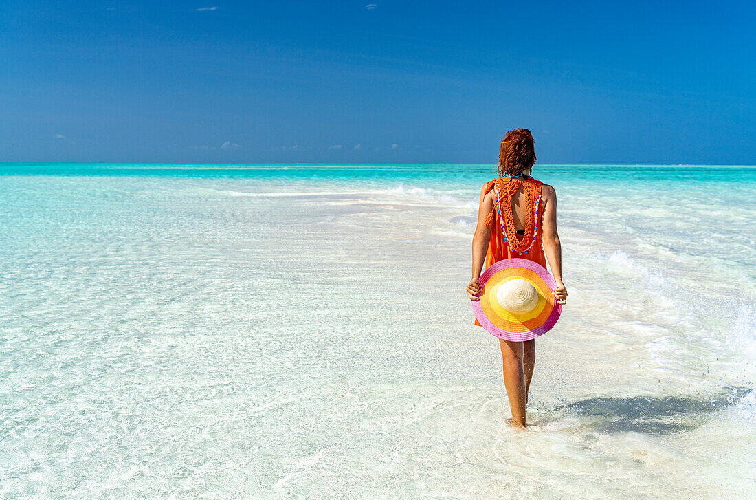 Mid adult woman enjoying walking on a beach, Zanzibar, Tanzania, East Africa, Africa