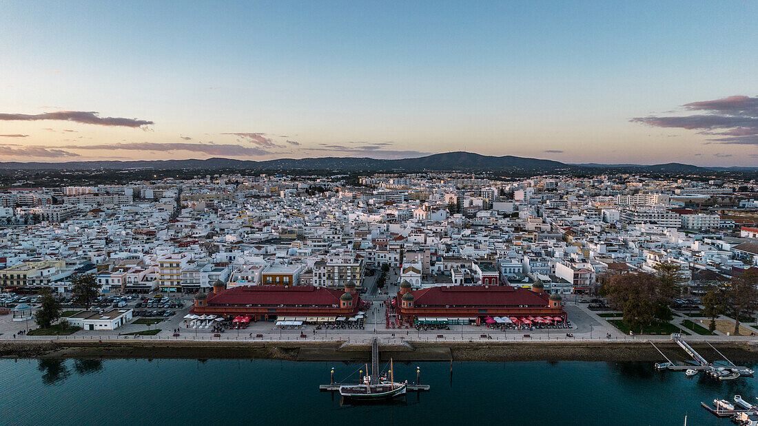 Aerial drone view of Olhao, officially known as Olhao da Restauracao, a city and municipality in the Algarve region, southern Portugal, Europe