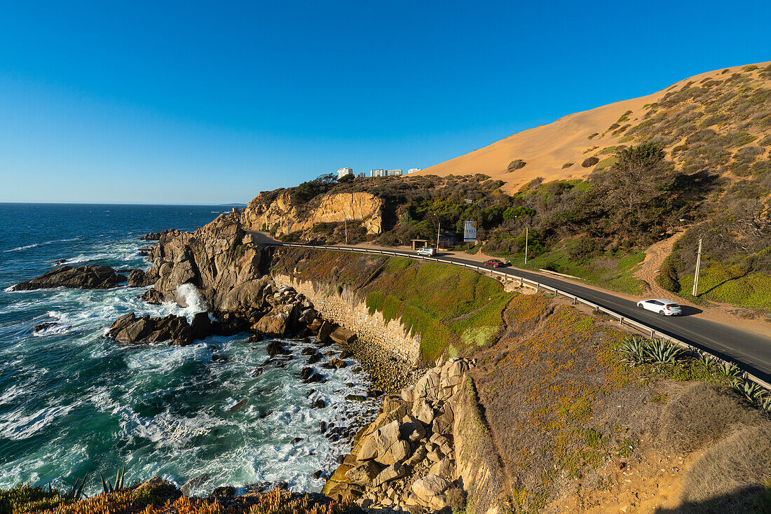 Coastal road by rocky coastline near Roca Oceanica, Concon, Valparaiso Province, Valparaiso Region, Chile, South America