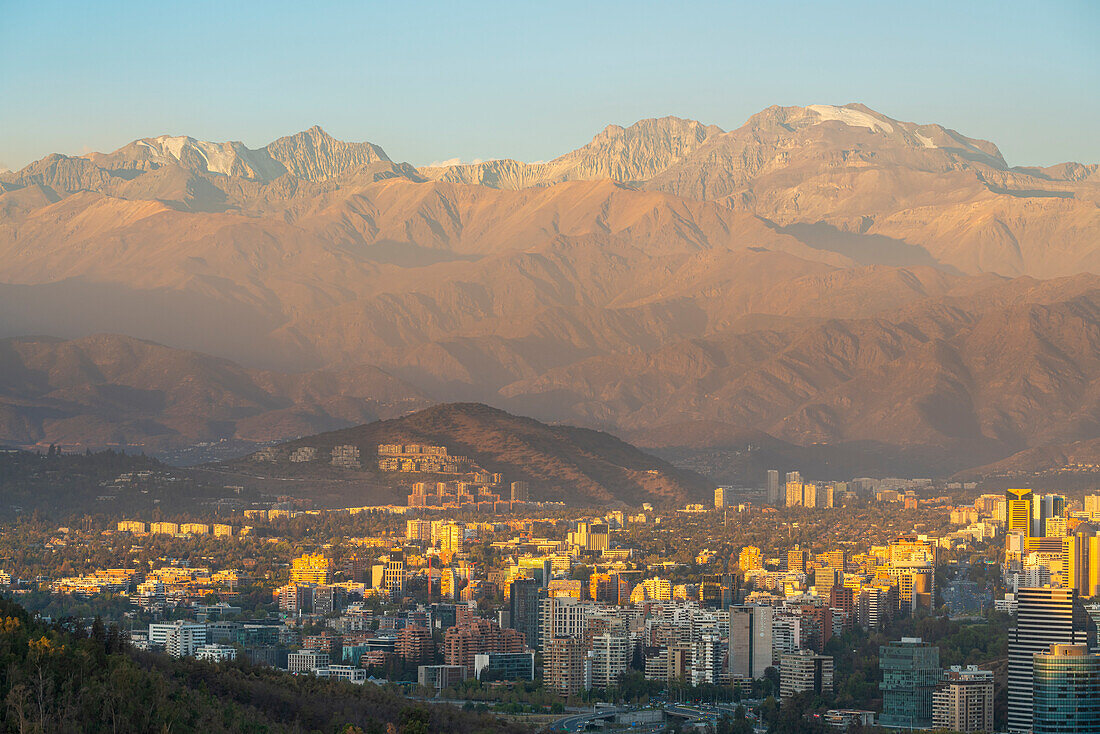 Vitacura and Jardin del Este neighborhoods seen from San Cristobal Hill (Metropolitan Park) with Andes in background at sunset, Santiago Metropolitan Region, Chile, South America