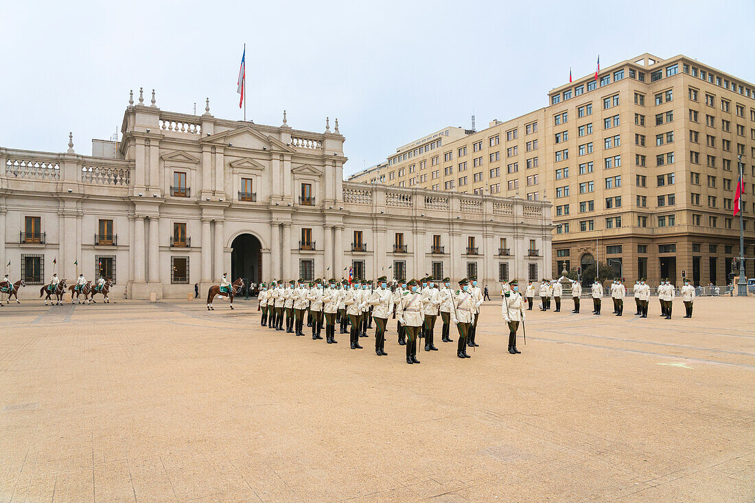 Policemen performing changing of guards ceremony in front of La Moneda Palace, Santiago, Santiago Metropolitan Region, Chile, South America