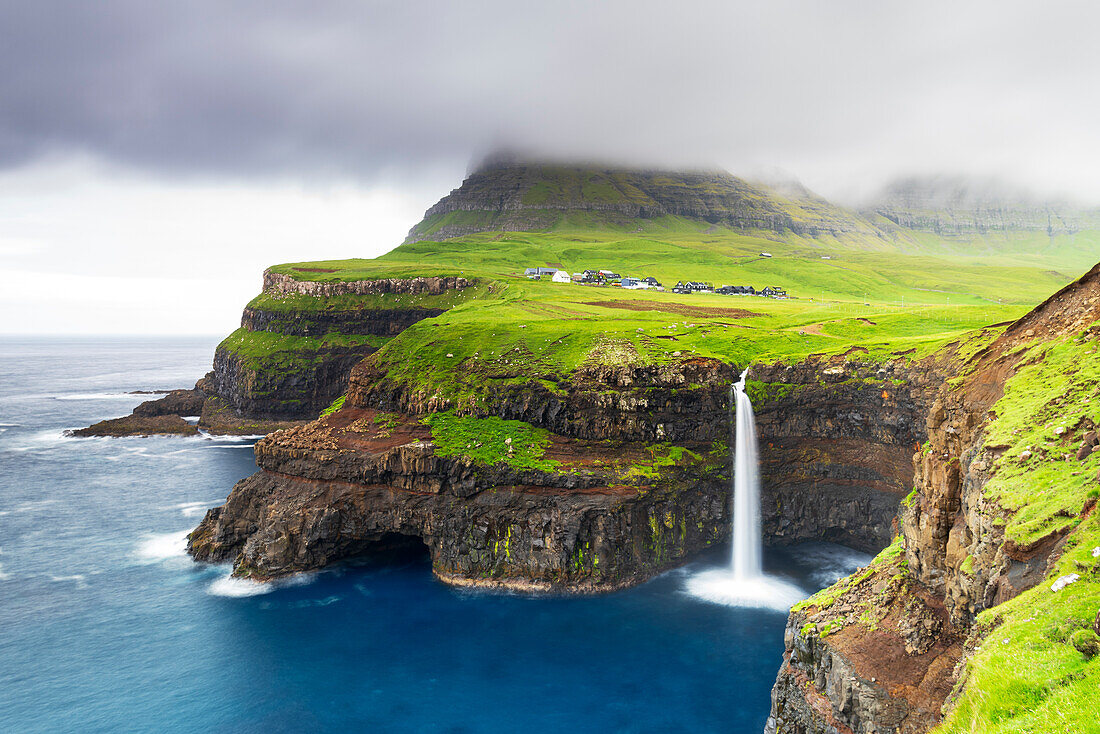 The iconic waterfall of Mulafossur, Gasadalur, Vagar, Faroe islands, Denmark, Northern Europe, Europe