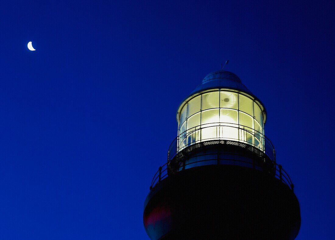 Moon Crescent Above Lighthouse At Dusk, Low Angle View, Close Up
