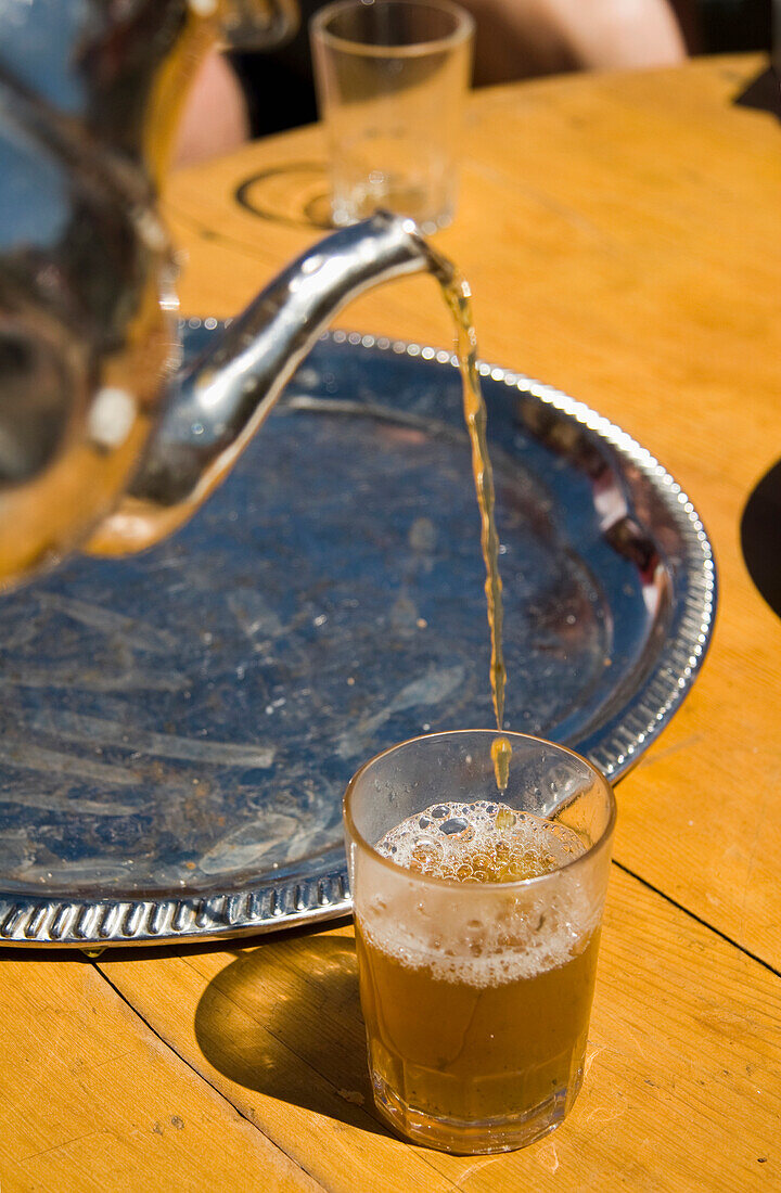 Mint Tea Pouring Into Glass