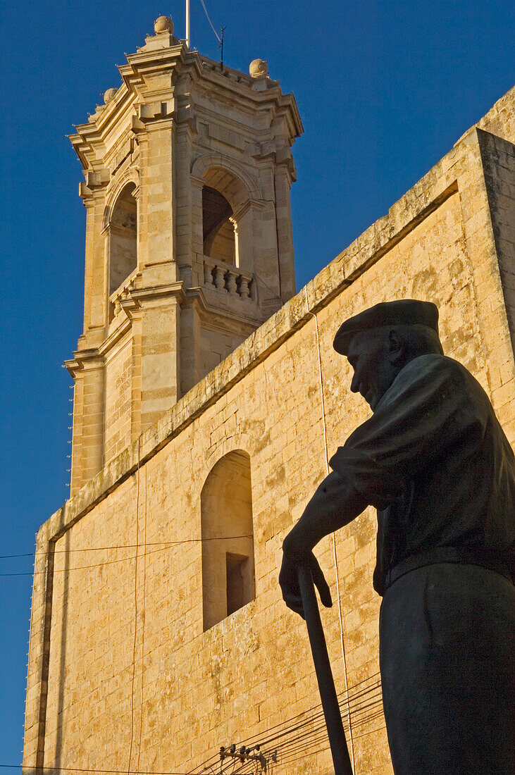 Statue In Front Of Gharb Parish Church