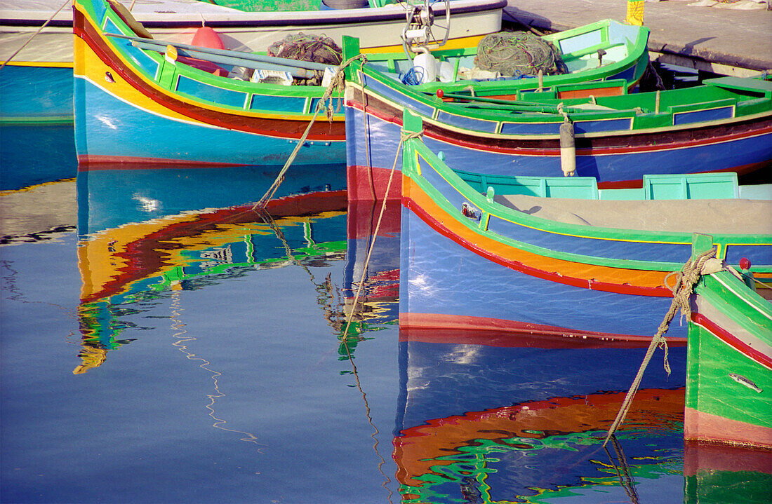Malta, Striped Boats Moored In Harbour; Gozo