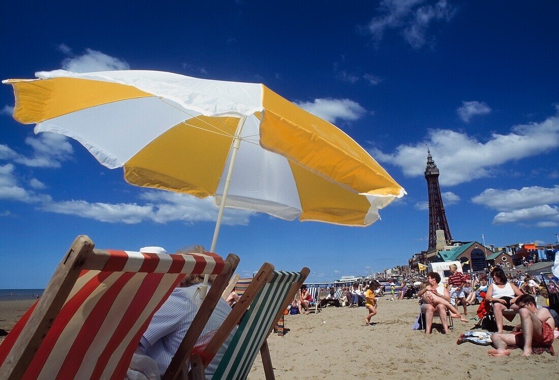 Beach With Umbrella And Deck Chairs