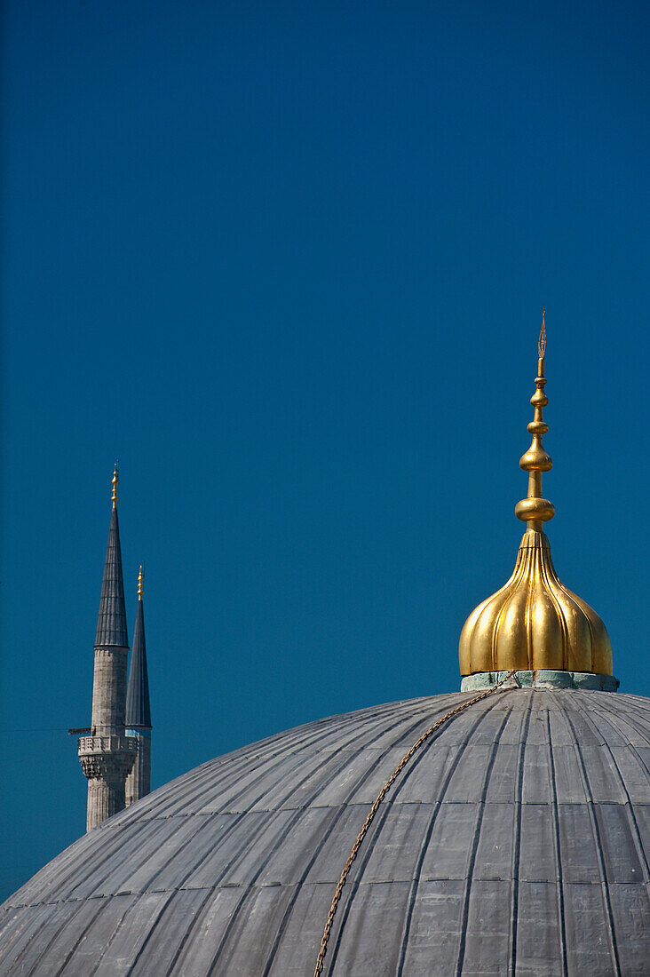 Turkey, Detail of domed roof of Hagia Sofia and minarets of Sultanahmet or Blue Mosque; Istanbul