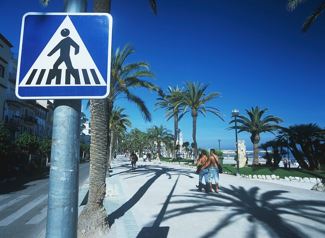 Spain, Promenade With Palm Trees And Road Sign; Sitges