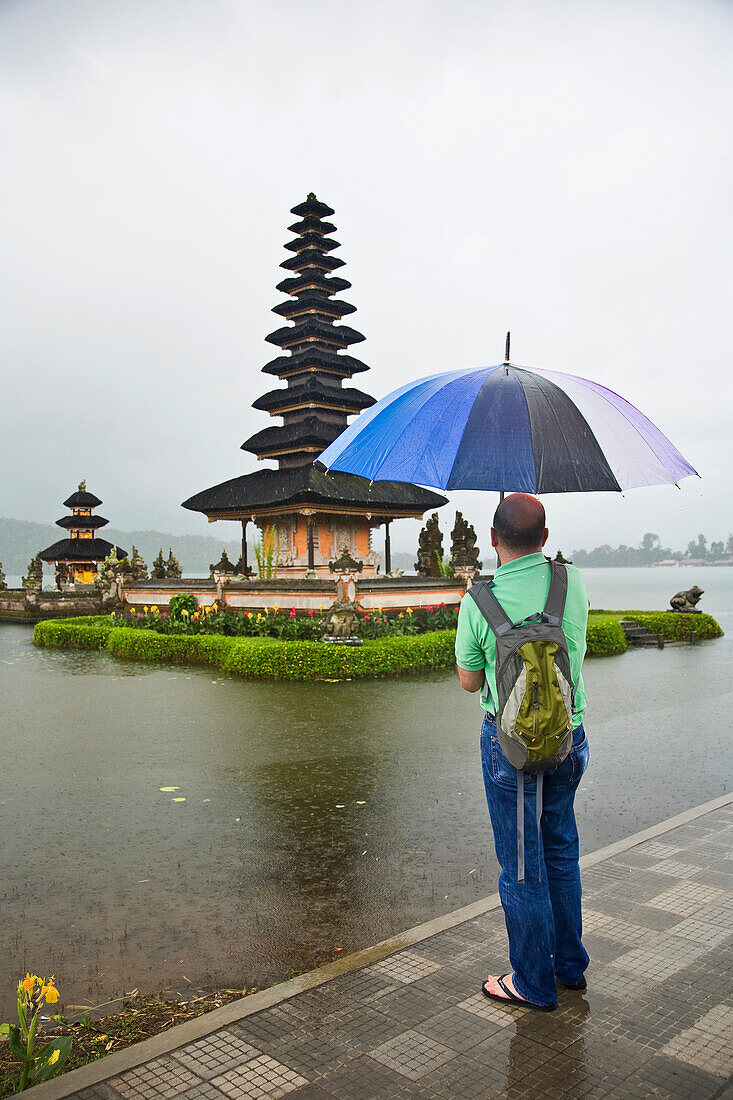 Tourist Looking At Temple Pura Danu Beratan