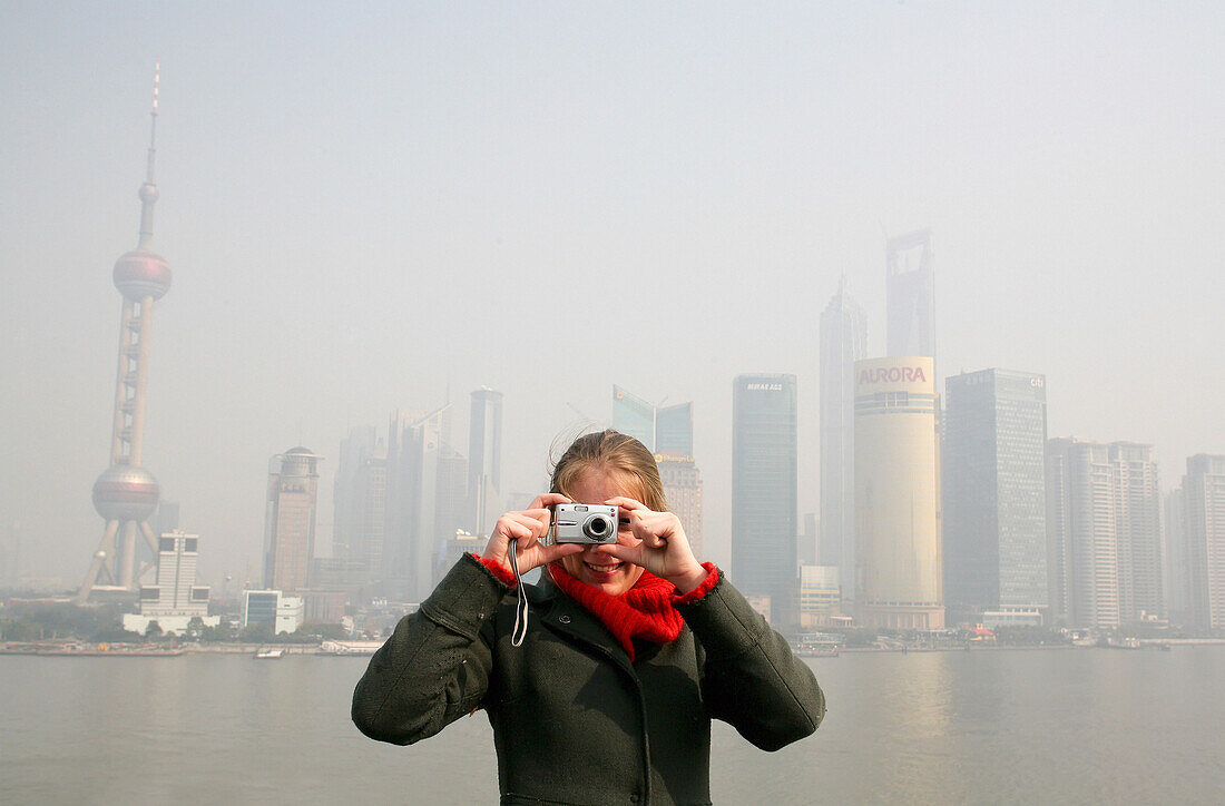 Tourist Taking Picture Over Bund,Huangpu River With Pudong Skyline In Background, Shanghai,China