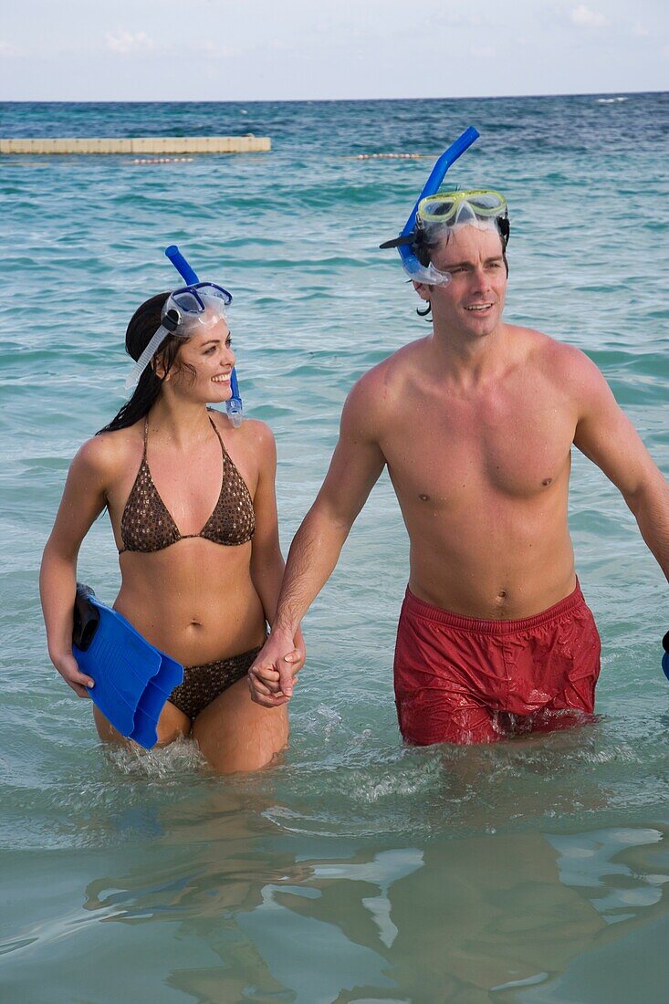 Young Couple With Snorkeling Gear In Sea On Mayan Riviera, Yucatan Peninsular,Quintana Roo State,Mexico