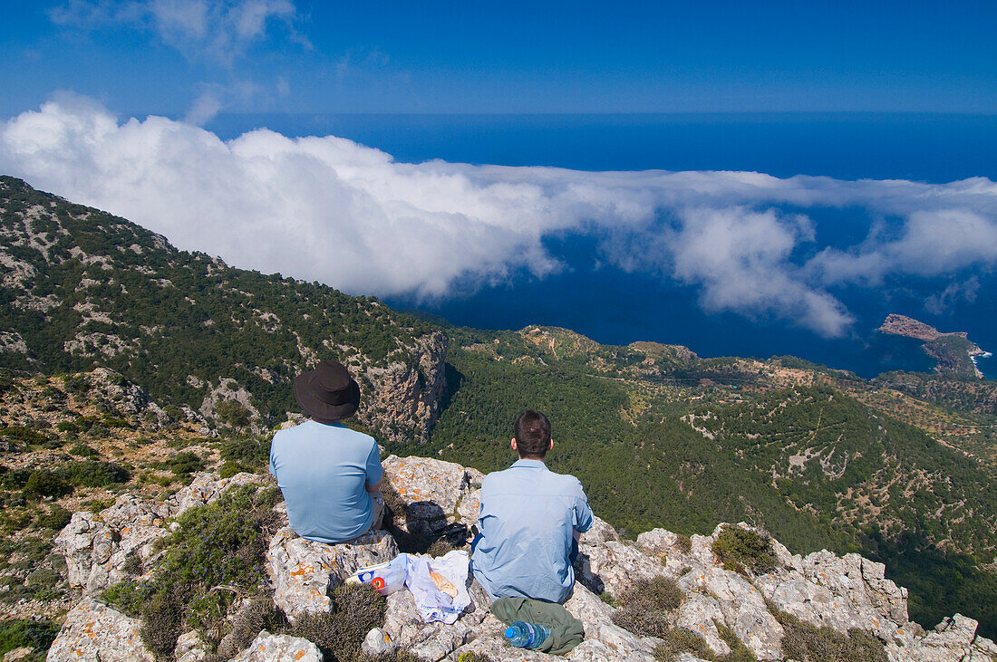 Two People Looking At Coastline From Mountain Top,Rear View, Majorca,Balearic Islands,Spain